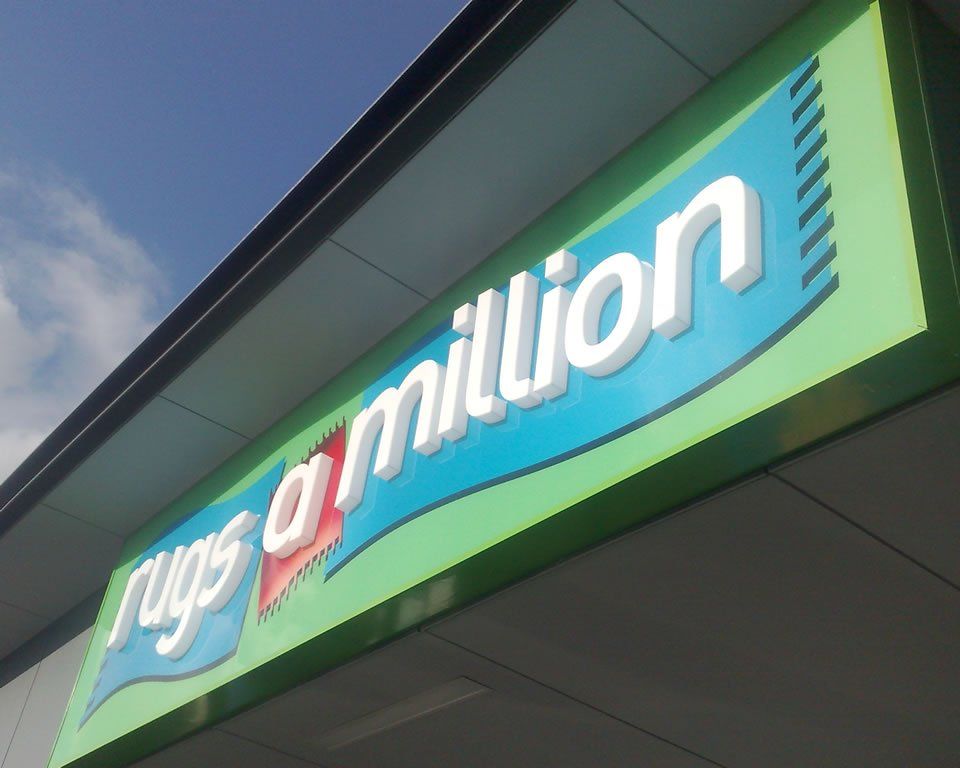 rugs a million sign