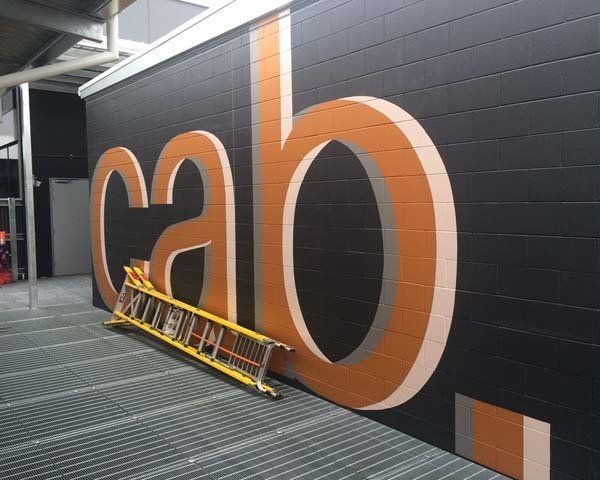 large wall with cab sign