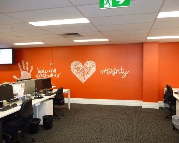 orange wall with integrity print