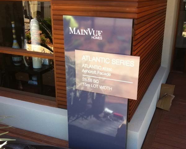 blue and silver display home sign