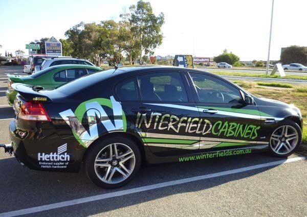 green and silver car vinyl lettering